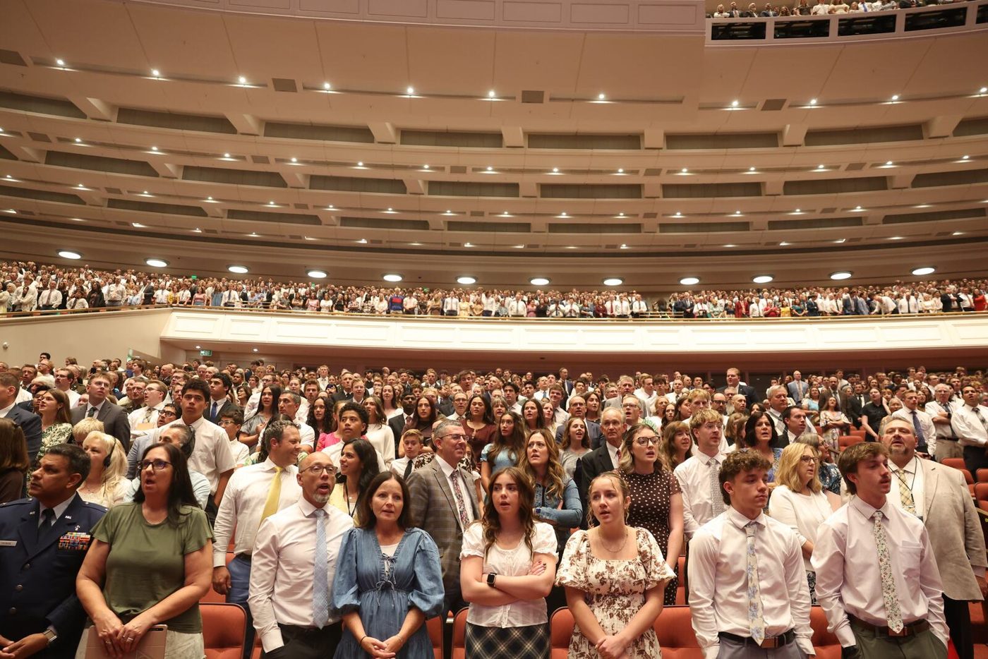 Conferencegoers singing a hymn in the Conference Center during general conference on Oct. 4, 2026