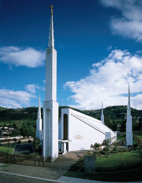 The Guatemala City Guatemala Temple's white spire against a blue sky