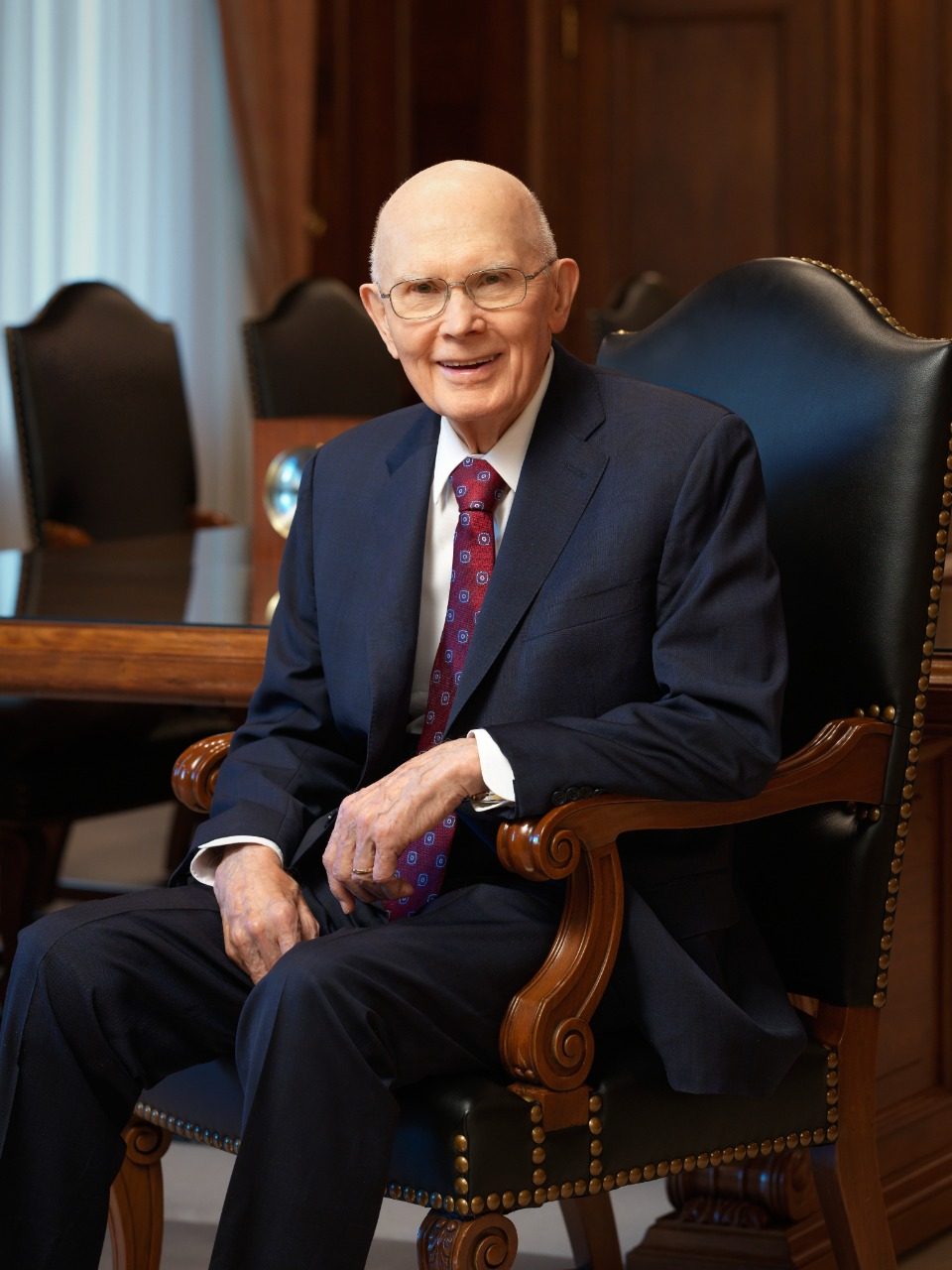 Official portrait of President Dallin H. Oaks seated in a chair