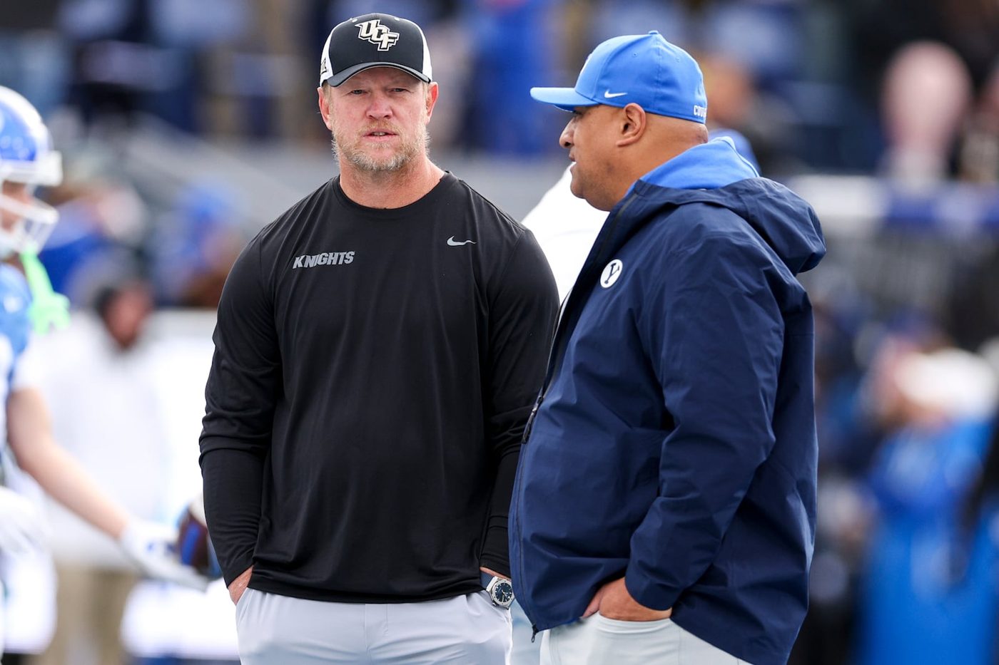 UCF coach Scott Frost and BYU coach Kalani Sitake talking on the field before their 2025 game in Provo (file photo)